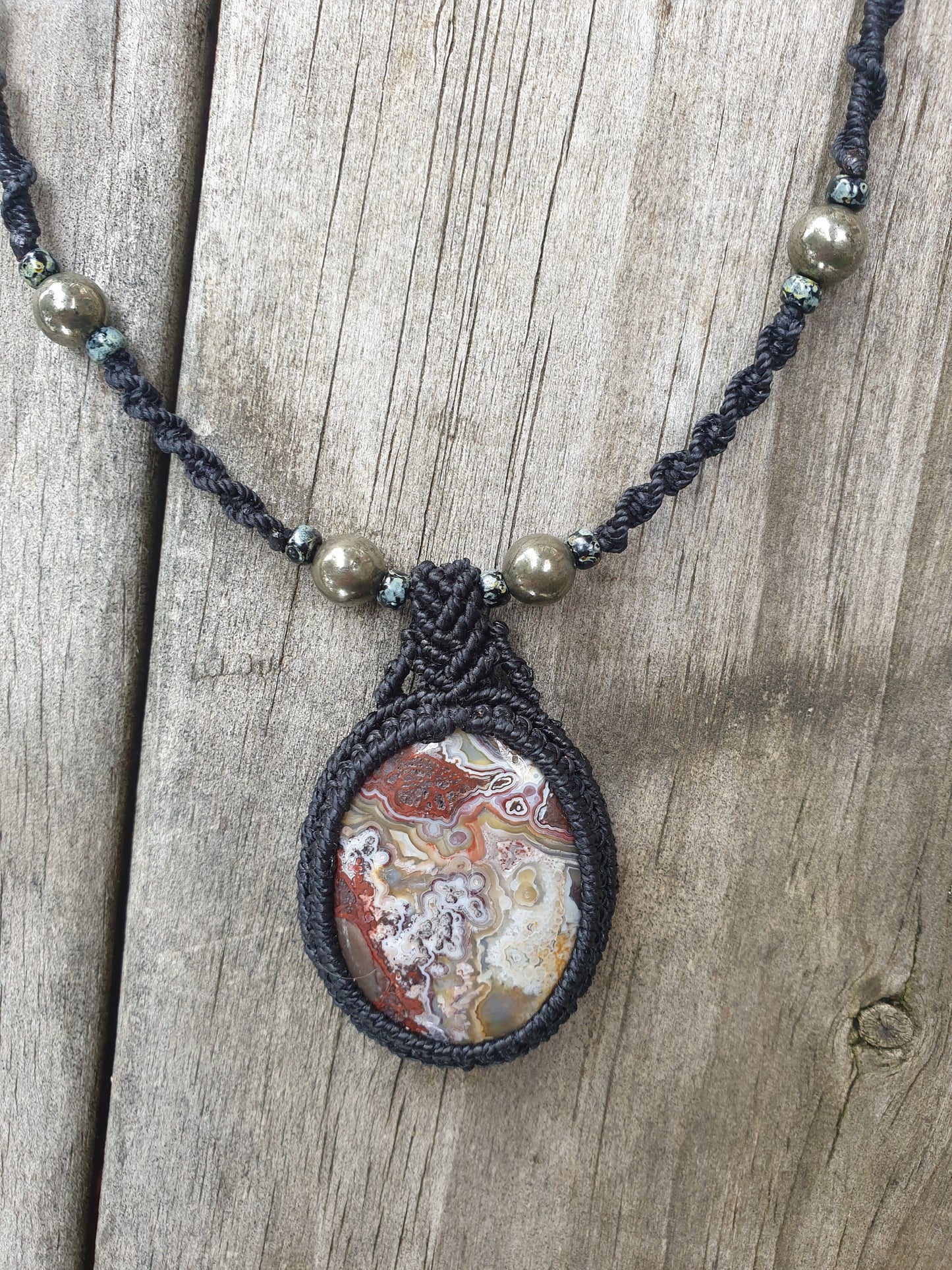Crazy Lace Agate and Pyrite macrame pendant